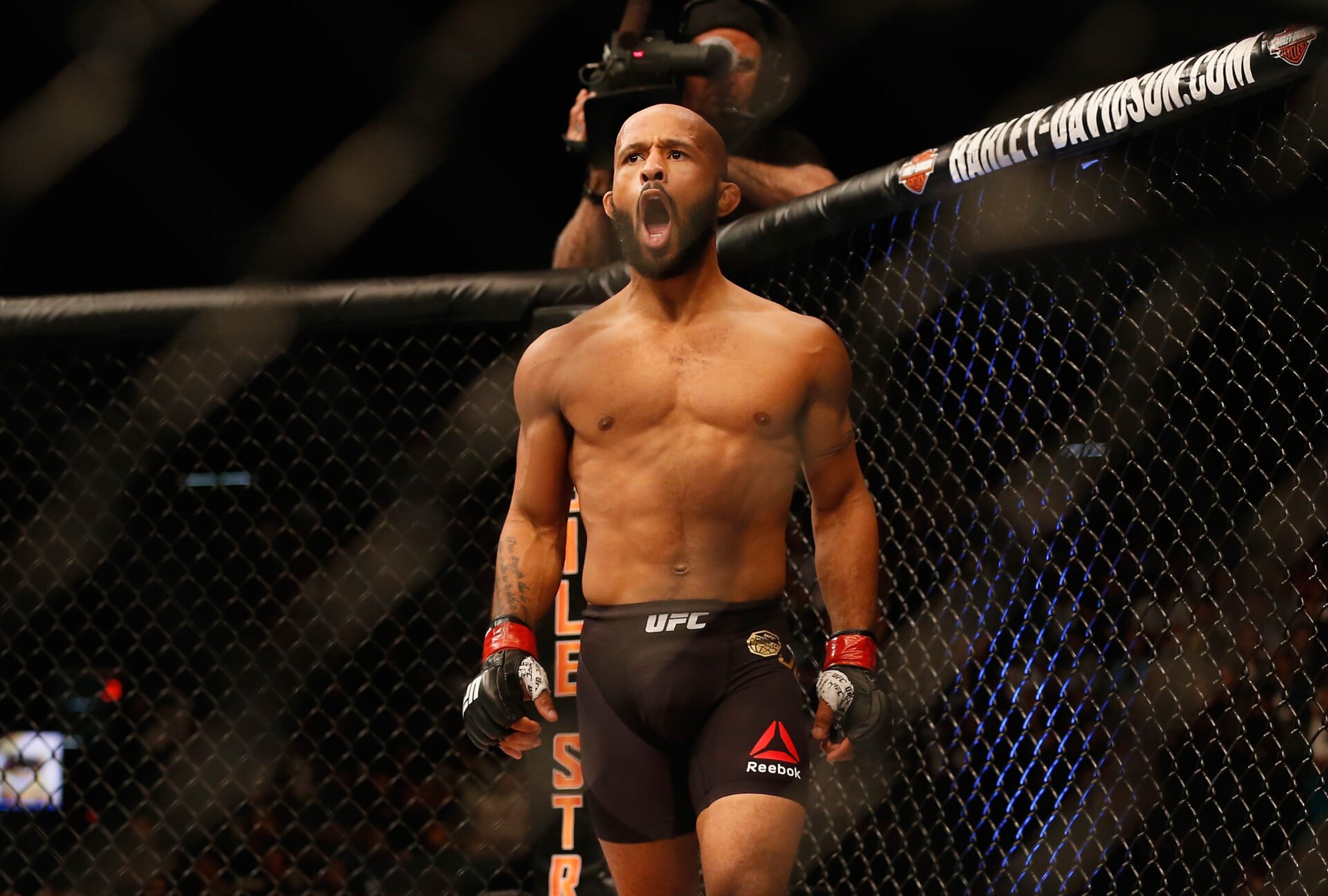 Demetrious Johnson reacts after finishing Henry Cejudo at UFC 197.