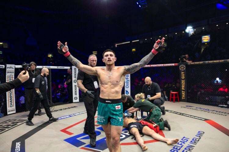 Connor Hughes celebrates as medics attend to his unconcious opponent,