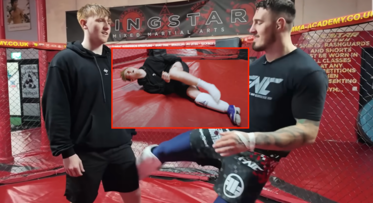 Tom Aspinall kicking AngryGinge, with a block showing AngryGinge on the ground