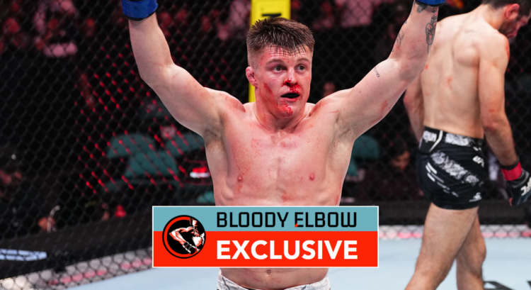 Caolan Loughran, with blood on his face, celebrates a UFC win. Overlay text reads: BLOODY ELBOW EXCLUSIVE