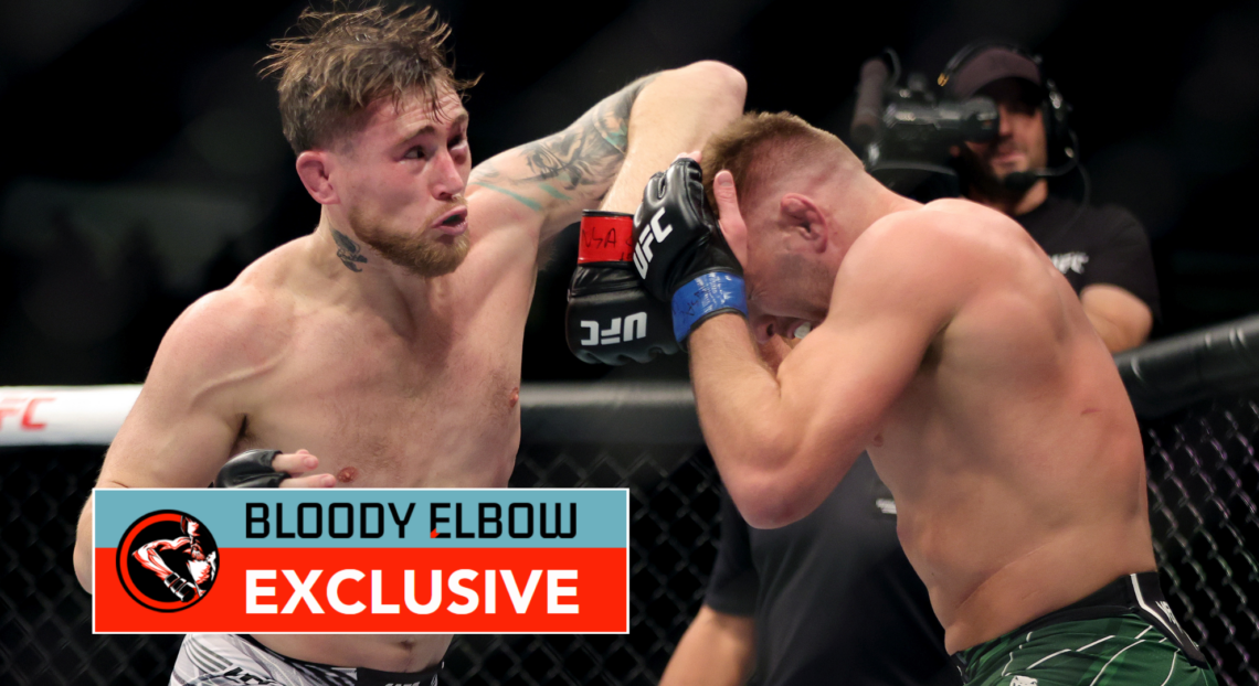 Darren Till elbows Dricus Du Plessis during their UFC 282 fight