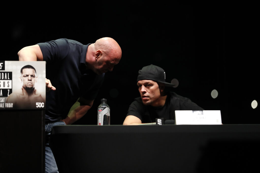 Dana White speaks to Nate Diaz while on stage for the UFC 244 press conference.