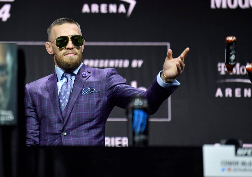 Conor McGregor acknowledges the crowd at the UFC 264 press conference