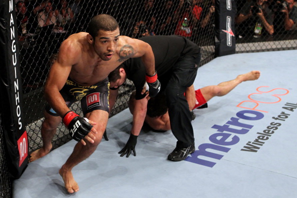 Jose Aldo runs off in celebration after beating Chad Mendes at UFC 142
