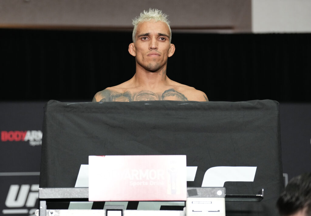 Charles Oliveira on the scales ahead of his UFC 274 fight against Justin Gaethje