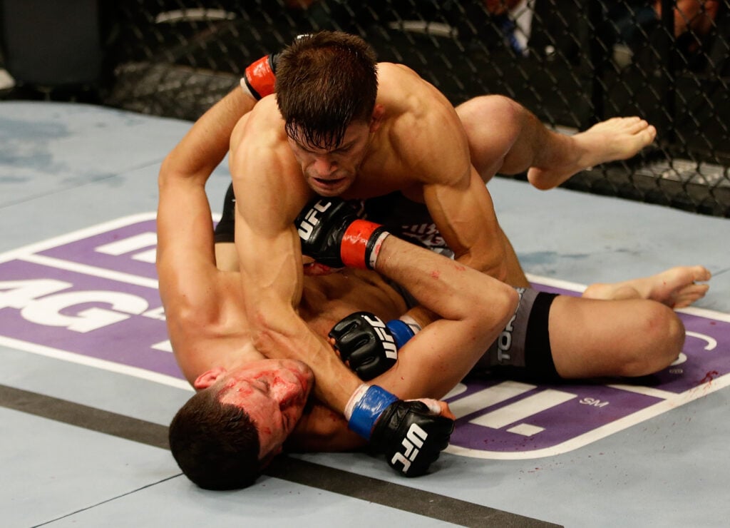 Josh Thomson punches Nate Diaz during their UFC on Fox fight.