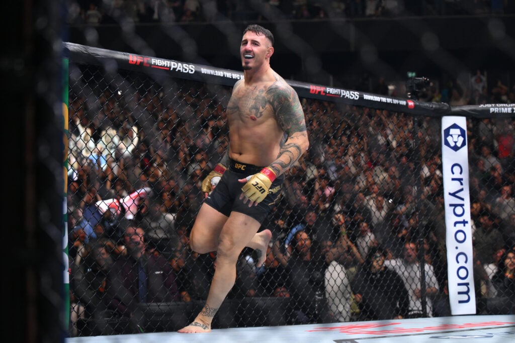 Tom Aspinall celebrates after knocking out Curtis Blaydes at UFC 304.