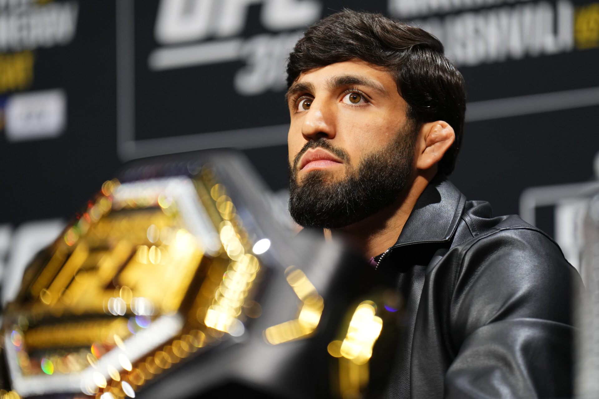 Arman Tsarukyan is seen on stage during the UFC 311 press conference