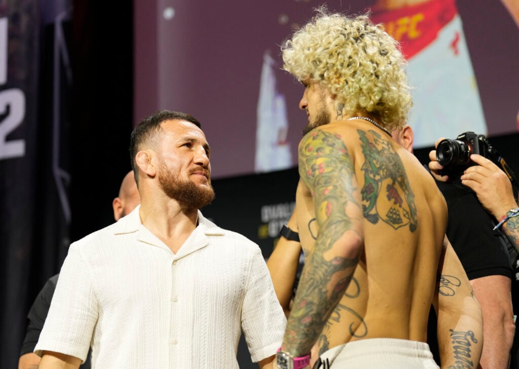 Image of Merab Dvalishvili facing off with Sean O'Malley at the UFC 316 press conference