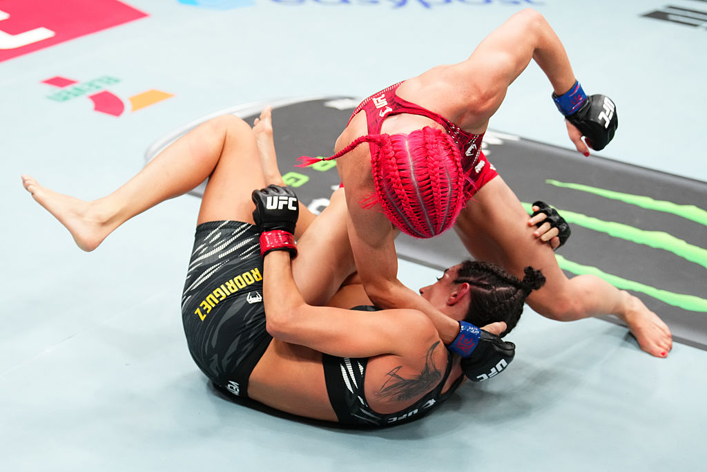 Gillian Robertson punches Marina Rodriguez during a scramble at UFC Des Moines