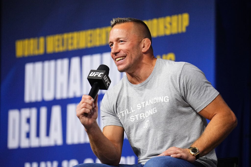 Georges St-Pierre answers questions at the UFC 315 ceremonial weigh-ins