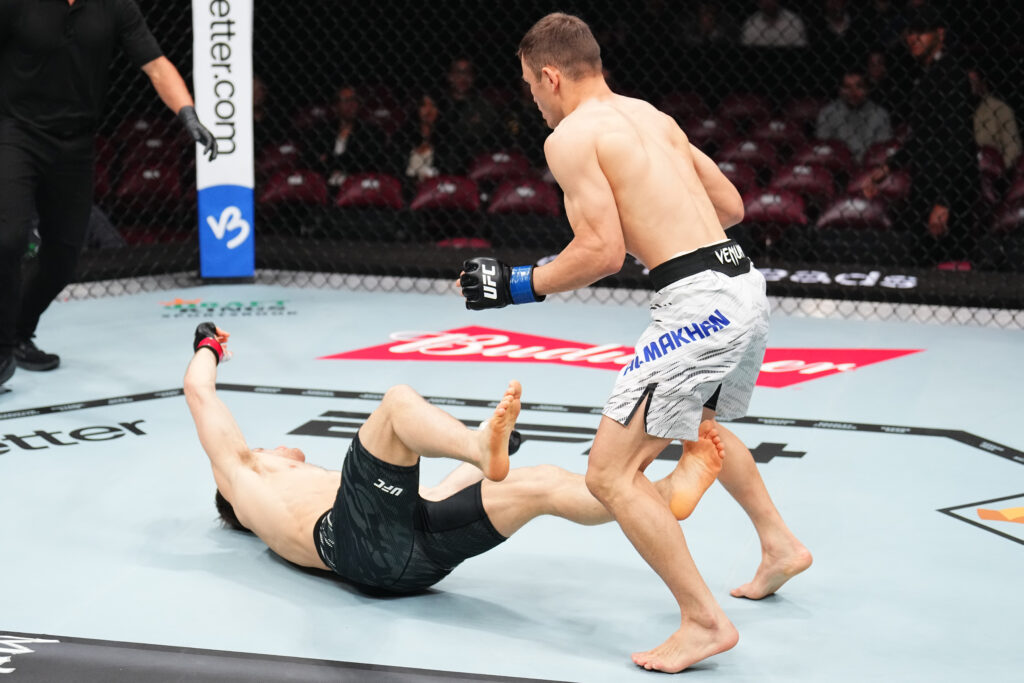Bekzat Almakhan presses after knocking down Brad Katona at UFC 315