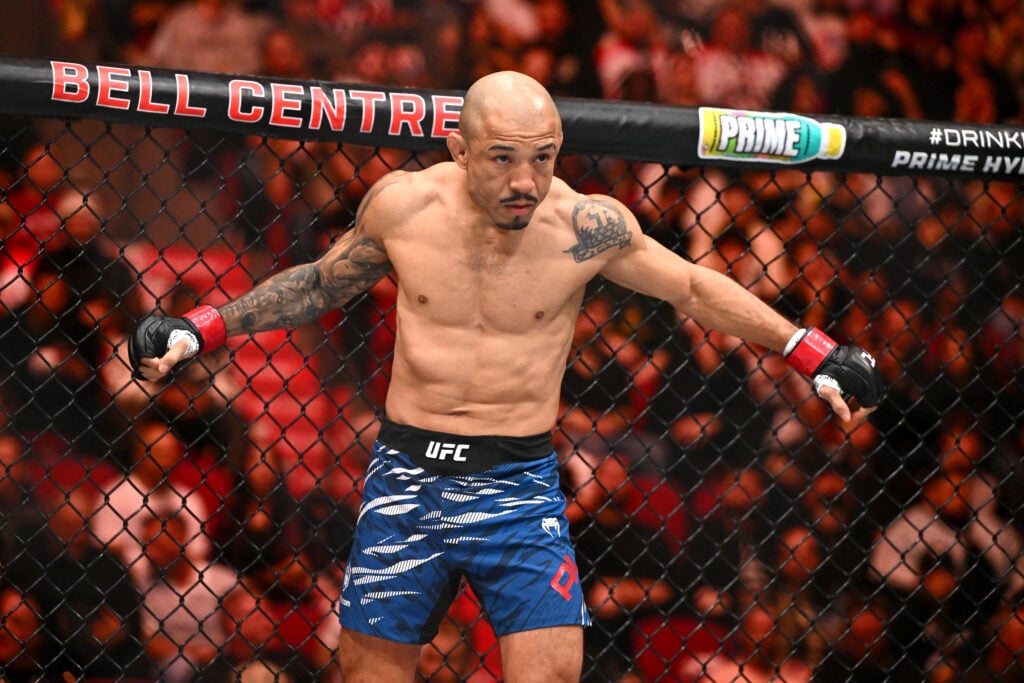 Jose Aldo stares down his opponent as the first round begins of his fight at UFC 315