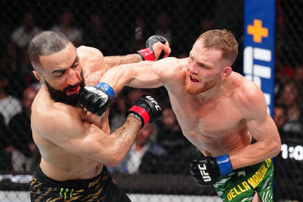 Jack Della Maddalena punches Belal Muhammad during their title fight at UFC 315