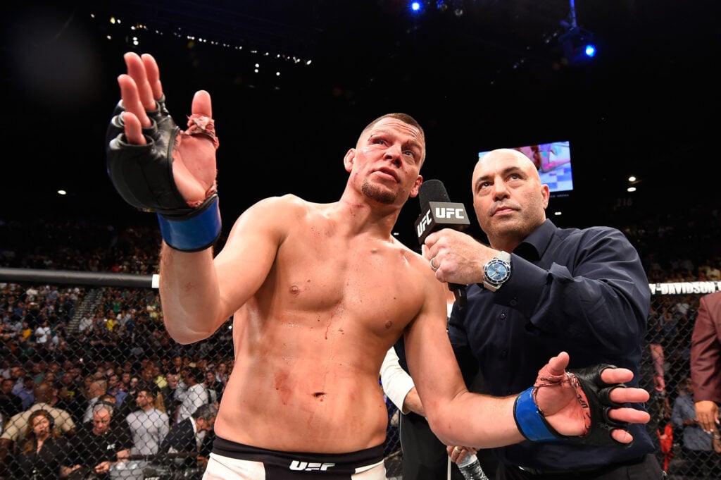 Nate Diaz talks to Joe Rogan inside the cage after submitting Conor McGregor at UFC 196