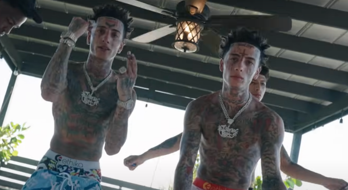The Island Boys rapping shirtless in a music video