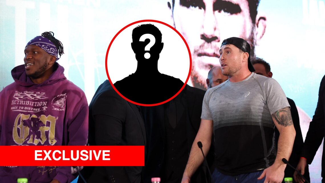 KSI and Darren Till being held back at a press conference, with a mystery box in a bubble in the middle and overlay text that reads 'EXCLUSIVE'