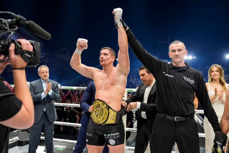 Rico Verhoeven gets his hand raised after beating Artem Vakhitov at Glory 100