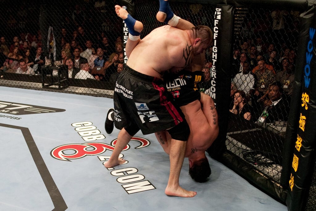 Frank Mir locks in an armbar during his fight against Tim Sylvia at UFC 48.
