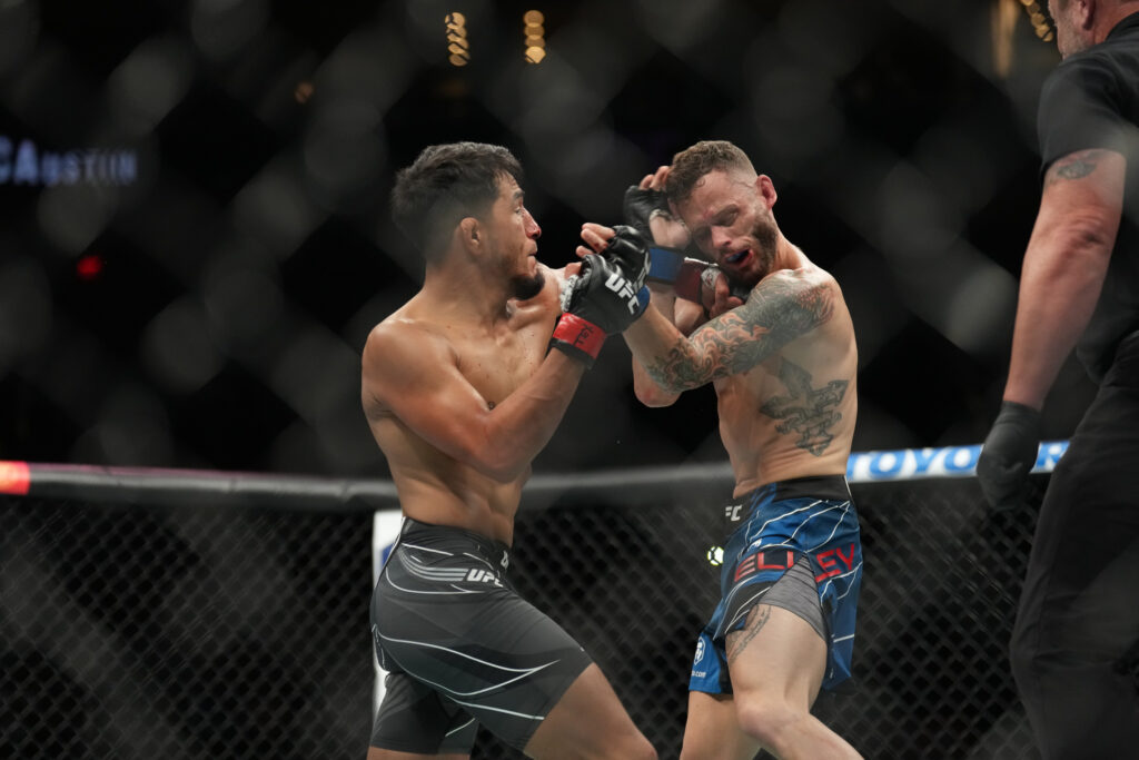 Adrian Yanez punches Tony Kelley during their fight at UFC Austin.