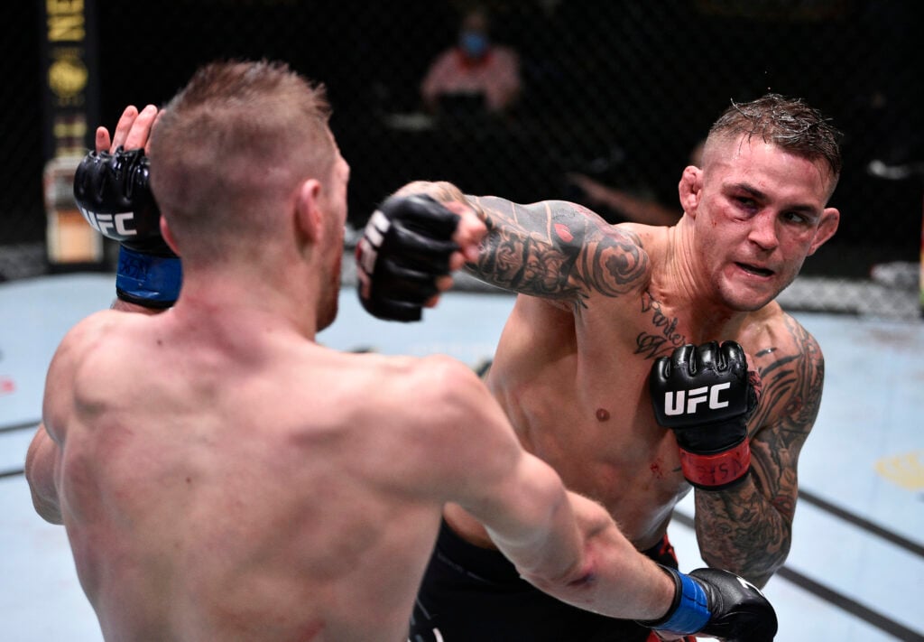 Dustin Poirier throws a right hand towards Dan Hooker during their 2020 UFC fight