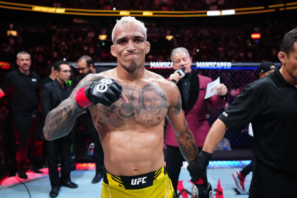 Charles Oliveira celebrates after beating Beneil Dariush at UFC 289.