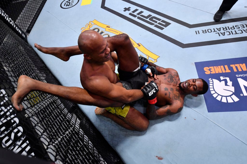Kevin Holland smiles at Jacare Souza during their UFC fight