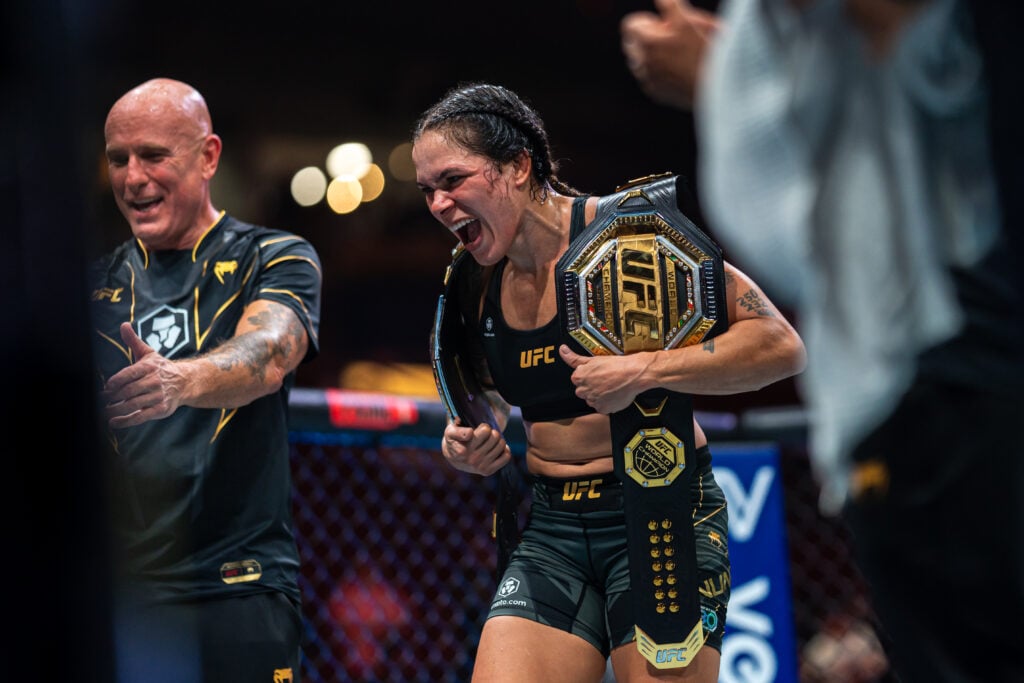 Amanda Nunes celebrates after beating Irene Aldana in their title fight at UFC 289.