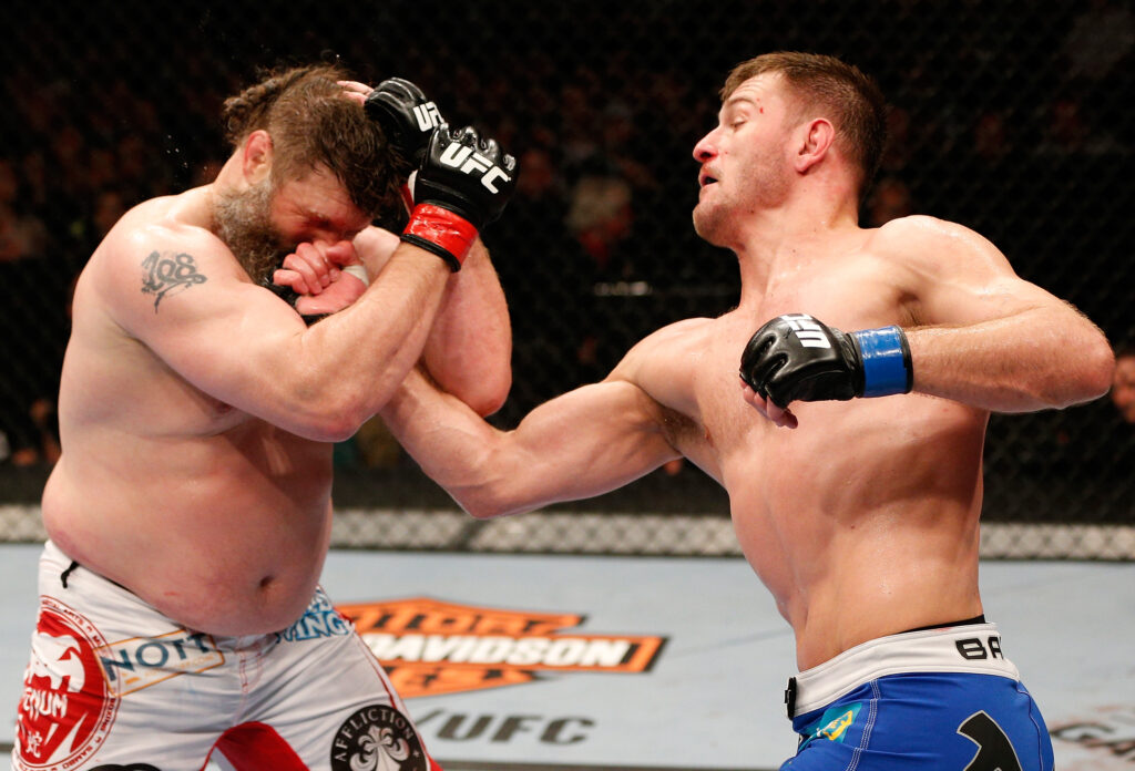 Stipe Miocic lands a left uppercut on Roy Nelson during UFC 161 fight