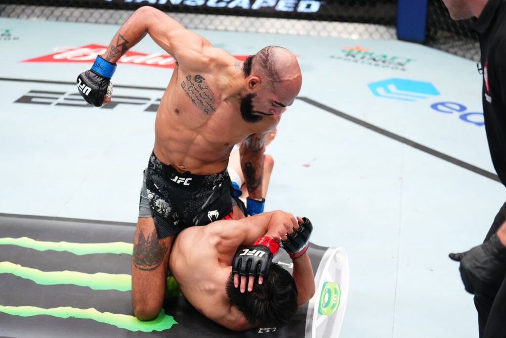 Charles Johnson punches Azat Maksum during their fight at UFC Vegas 85