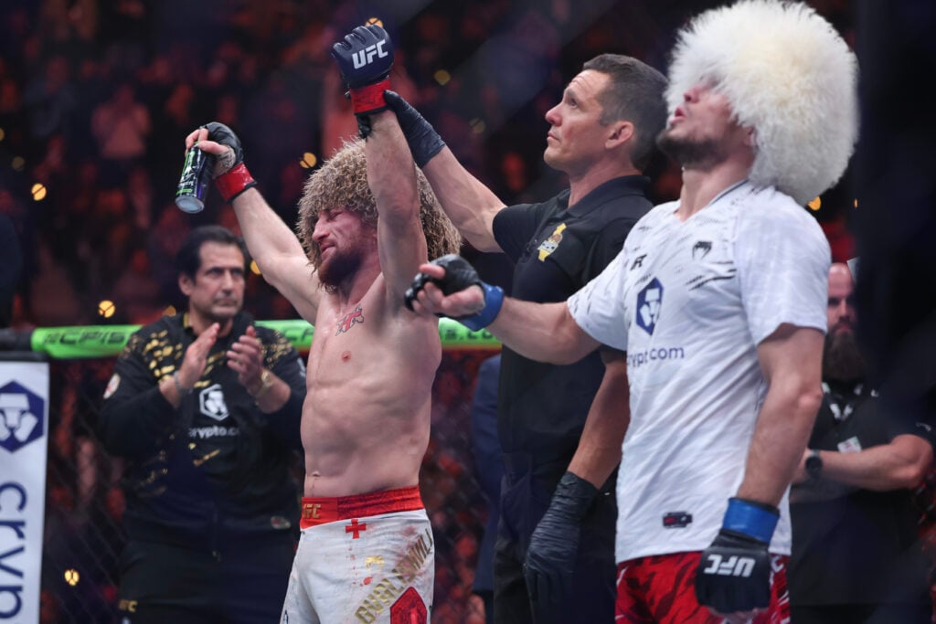 Merab Dvalishvili getting his hand raised against Umar Nurmagomedov at UFC 311