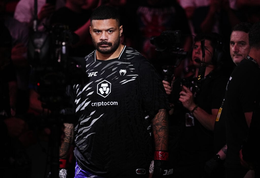 Justin Tafa walks to the cage for his fight against Tallison Teixeira at UFC 312.