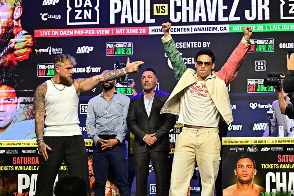 Jake Paul aims a gun sign at Julio Cesar Chavez Jr in their press conference
