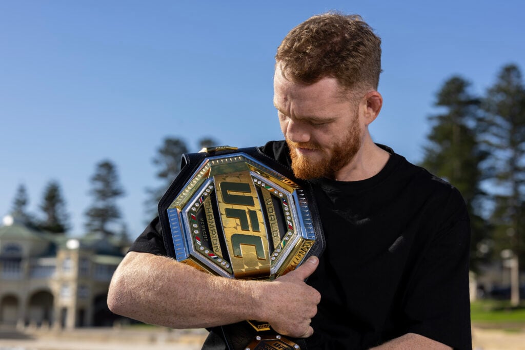 Jack Della Maddalena poses with his UFC belt during photo shoot