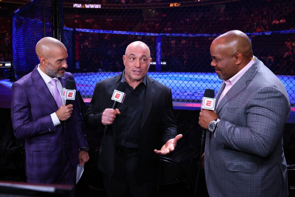 Jon Anik, Joe Rogan and Daniel Cormier commentating at UFC 316