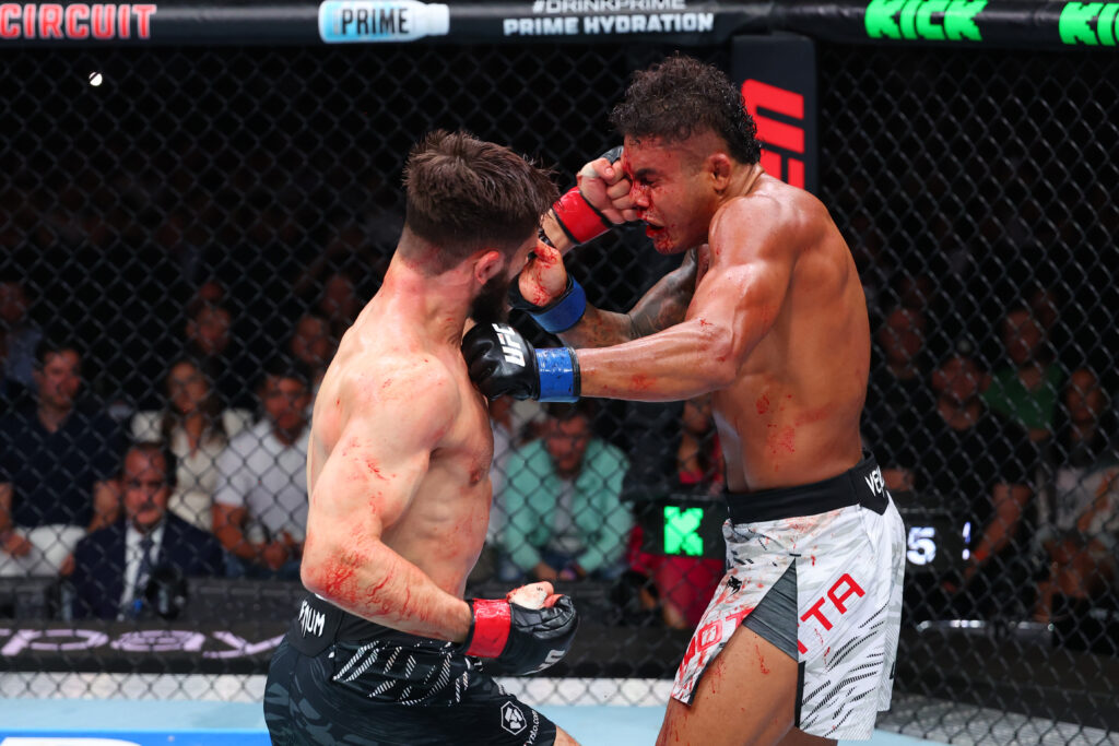 Nazim Sadykhov punches Nikolas Motta during their fight at UFC Baku