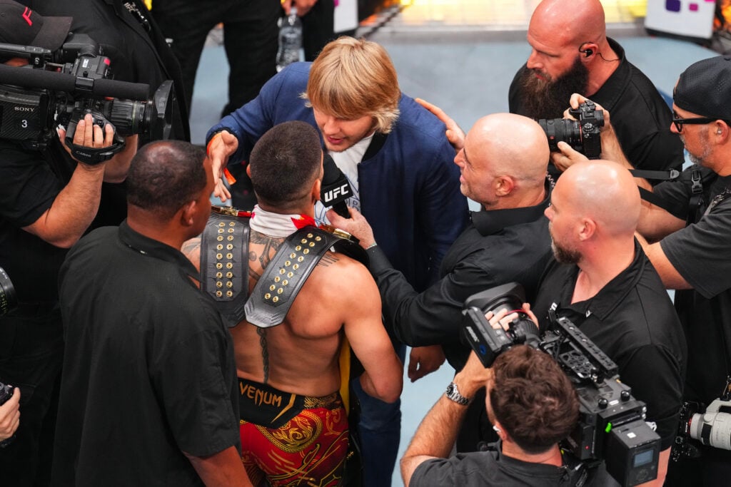 Ilia Topuria facing off with Paddy Pimblett at UFC 317