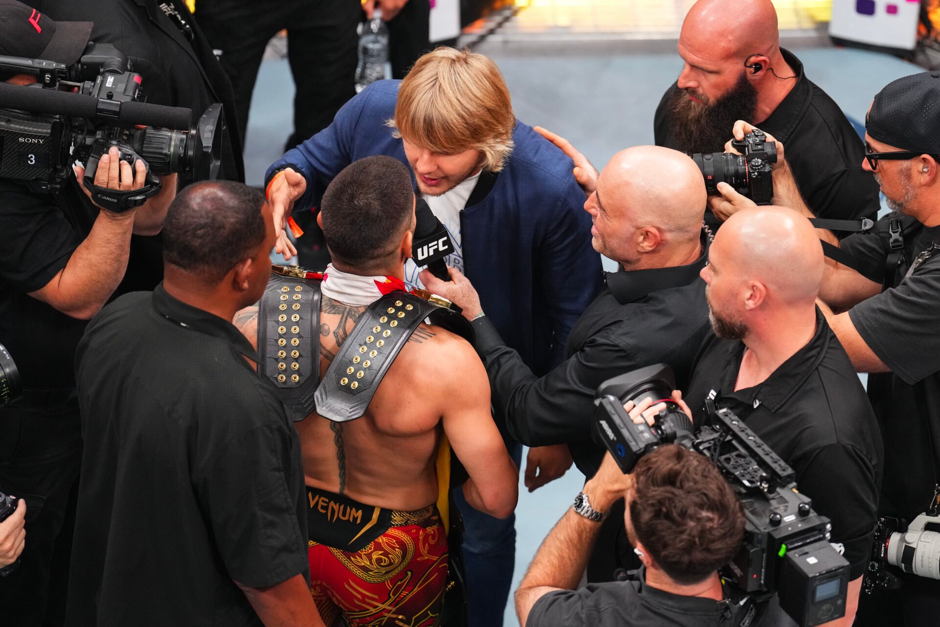 Ilia Topuria facing off with Paddy Pimblett at UFC 317