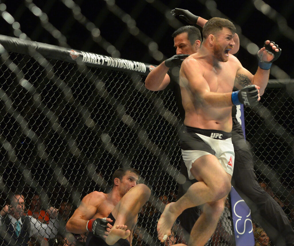 Michael Bisping celebrates his title win over Luke Rockhold at UFC 199.