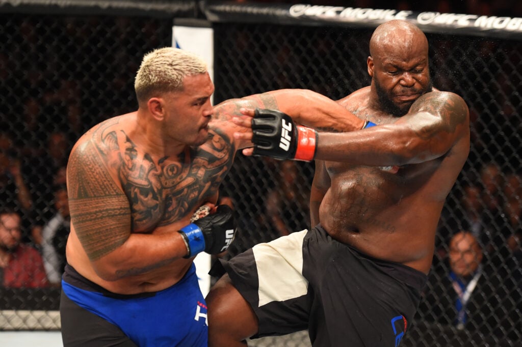 Mark Hunt lands left hand on Derrick Lewis during UFC Fight Night