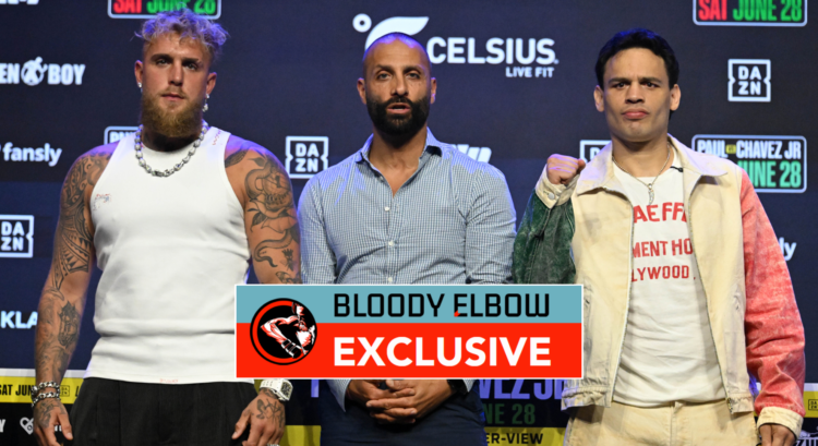 Jake Paul, Nakisa Bidarian and Julio Cesar Chavez Jr pose on stage at a press conference