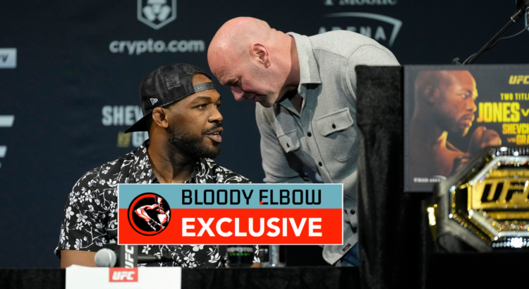Jon Jones and Dana White talking at a UFC press conference. Overlay text reads: BLOODY ELBOW EXCLUSIVE