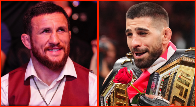Merab Dvalishvili sits cageside at UFC 317 in Las Vegas, opposite Ilia Topuria holding two UFC belts