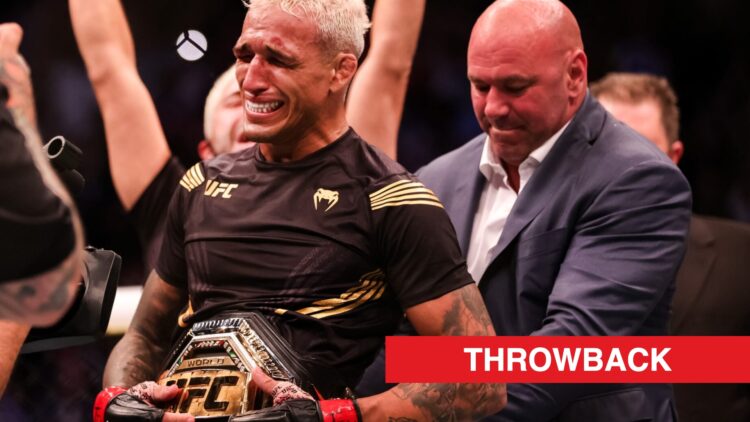 Charles Oliveira gets the lightweight title wrapped around him by Dana White at UFC 262