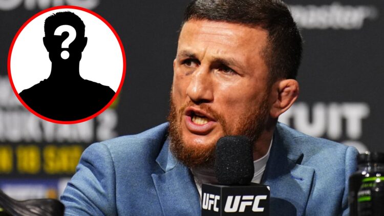 Merab Dvalishvili speaks at the UFC 311 press conference with an inset of a mystery icon