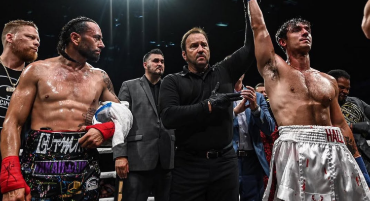 Bryce Hall (right) has his hand raised by the referee after his fight with Gee Perez (left) at BKFC 48