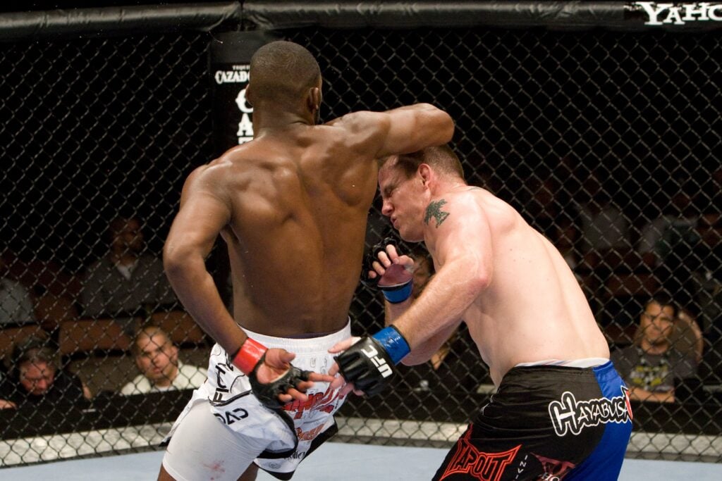 Jon Jones hits Jake O'Brien with a spinning elbow at UFC 100