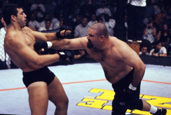 Tank Abbott punches Pedro Rizzo during their heavyweight fight at UFC: Brazil