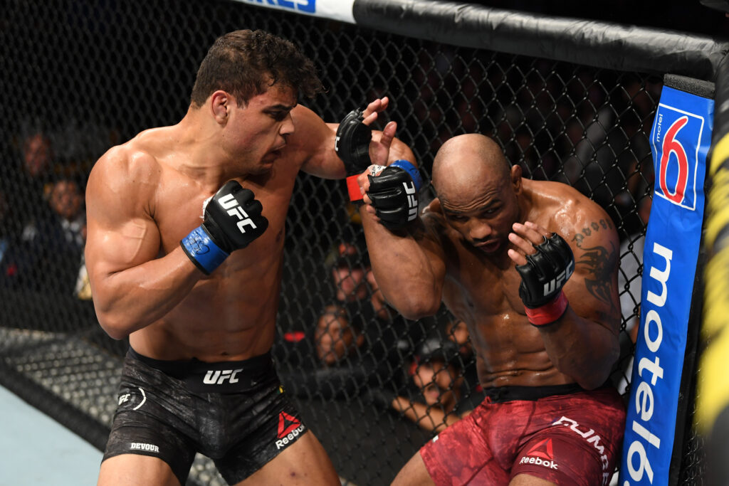 Paulo Costa punches Yoel Romero during their fight at UFC 241.