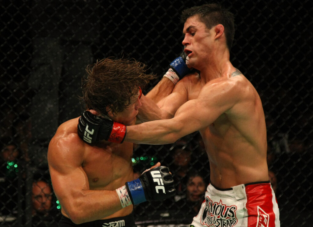 Urijah Faber punches Dominick Cruz at UFC 132